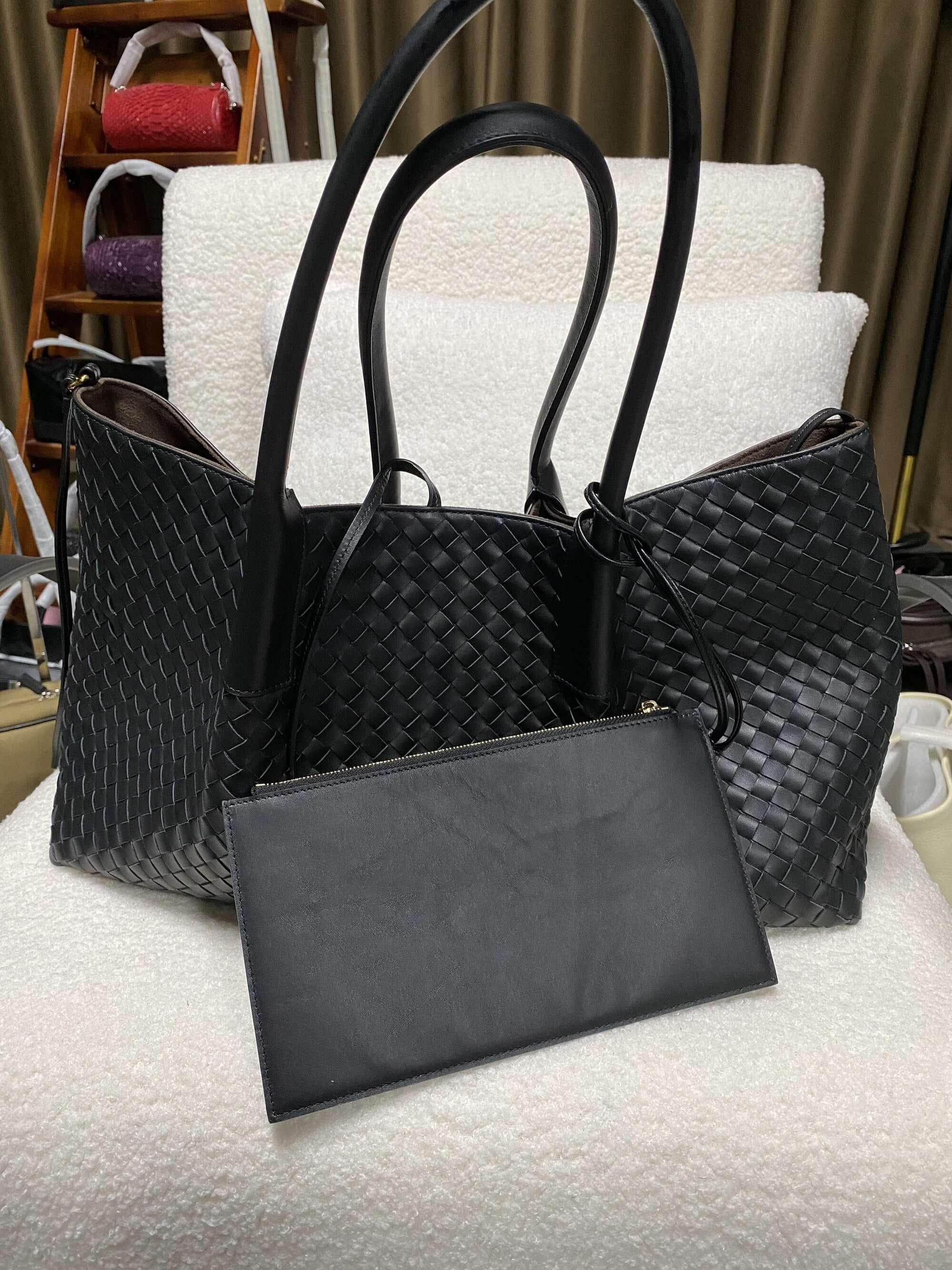Black woven leather tote with matching detachable pouch