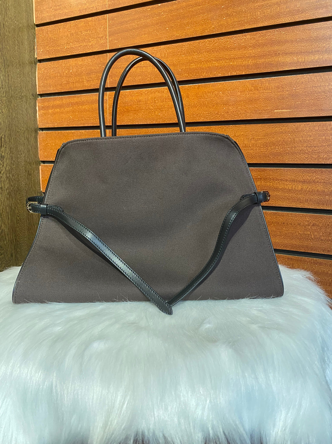 Coffee brown coated-canvas and full-grain cowhide structured tote with black handles and removable shoulder strap