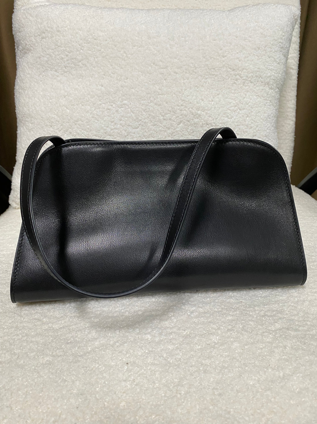 Smooth black leather shoulder bag back view
