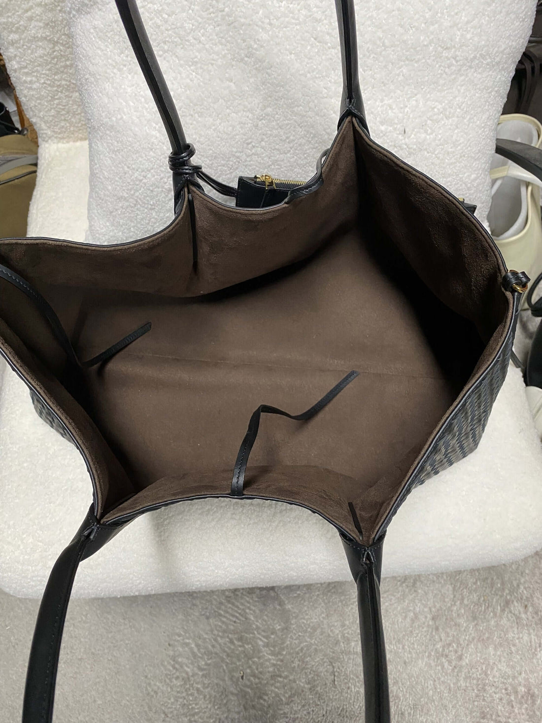 Logo-free top-grain cowhide woven tote — open interior with brown lining