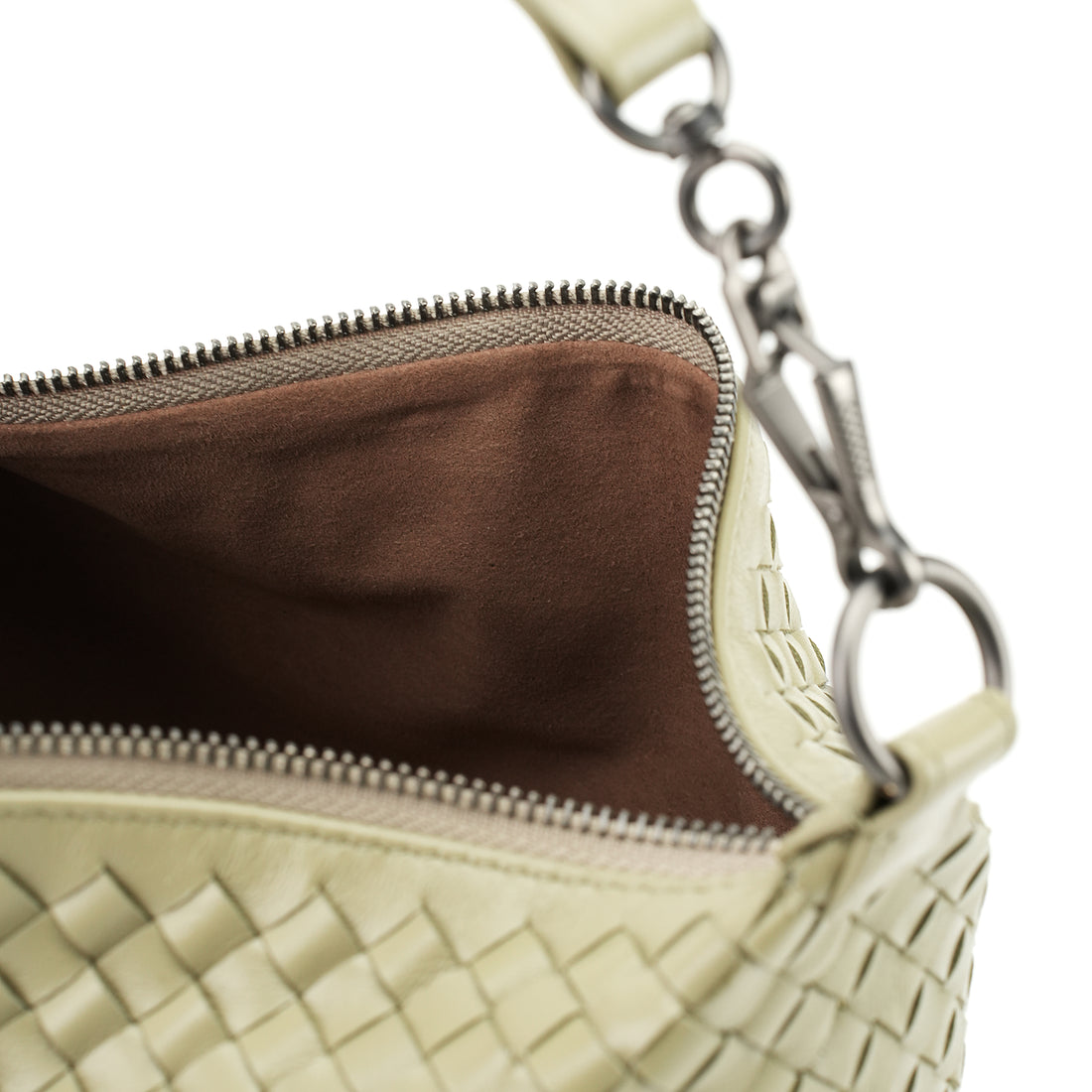 Logo-free handwoven lambskin shoulder bag — butter cream lining and zipper close-up