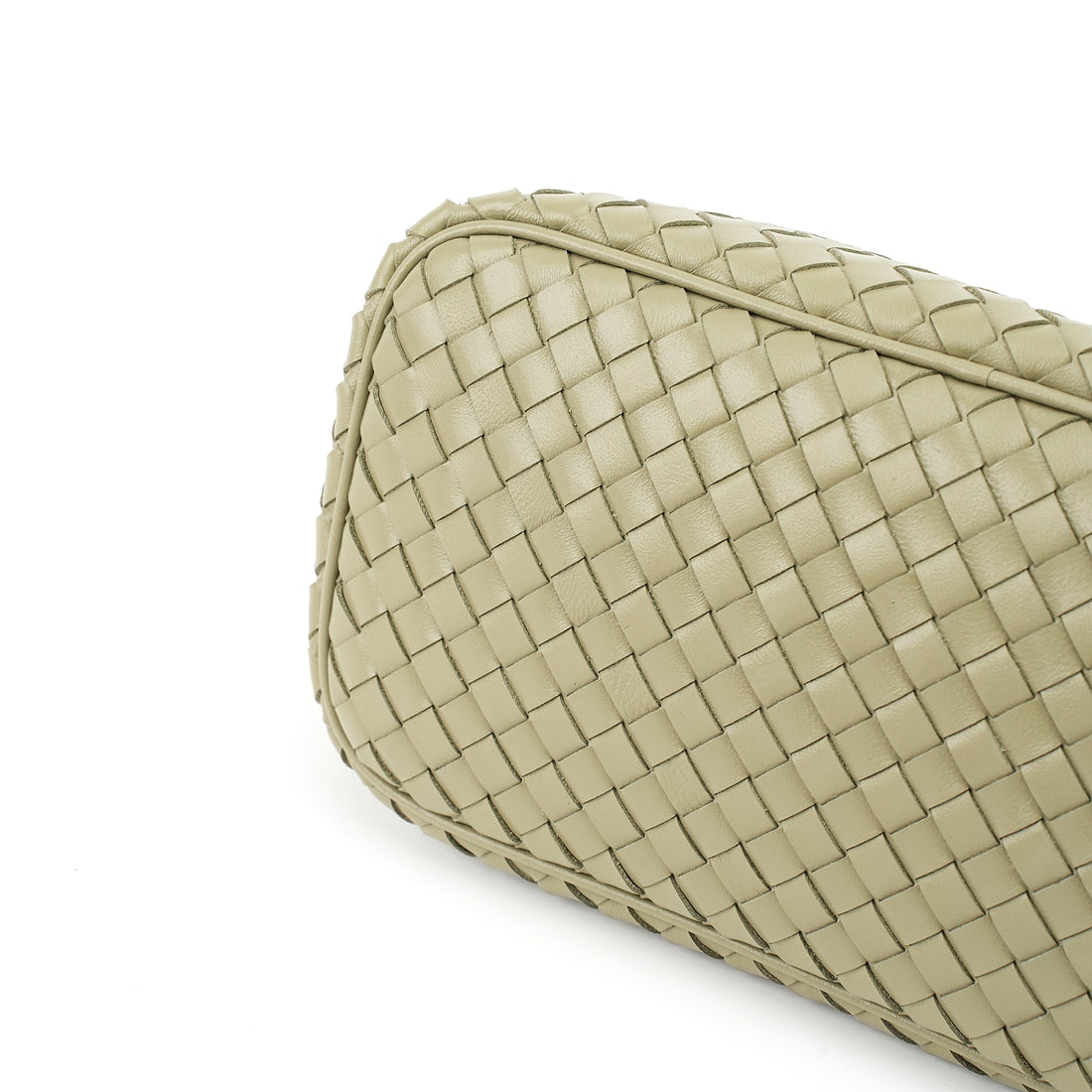 Logo-free handwoven lambskin shoulder bag — butter cream woven leather base close-up