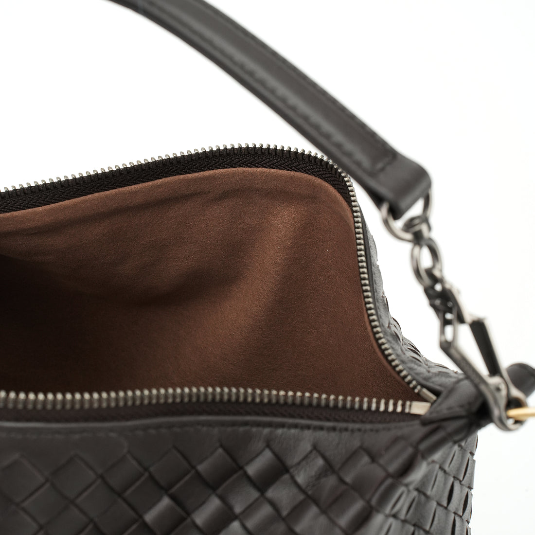 Logo-free handwoven lambskin shoulder bag — black open interior with brown lining