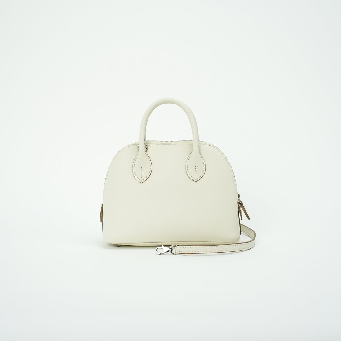 Cream top-grain leather dome handbag with silver-tone crossbody strap