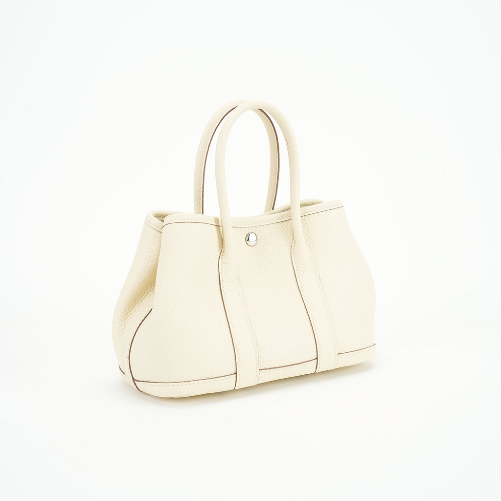Cream wide-top leather tote three-quarter view