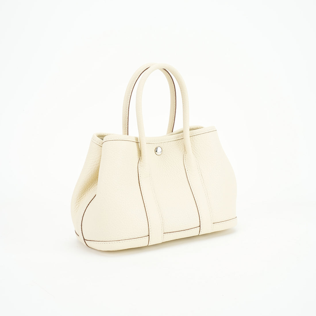 Cream wide-top leather tote three-quarter view