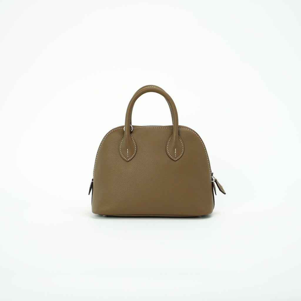Taupe brown dome leather handbag front view without shoulder strap