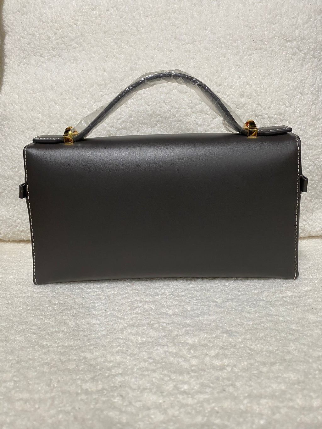 Dark brown calfskin box handbag back view with top handle