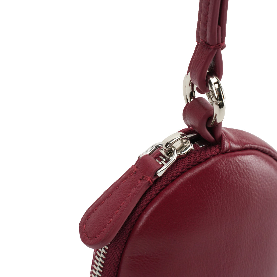 Logo-free cowhide glasses wallet with long strap — burgundy zipper hardware close-up