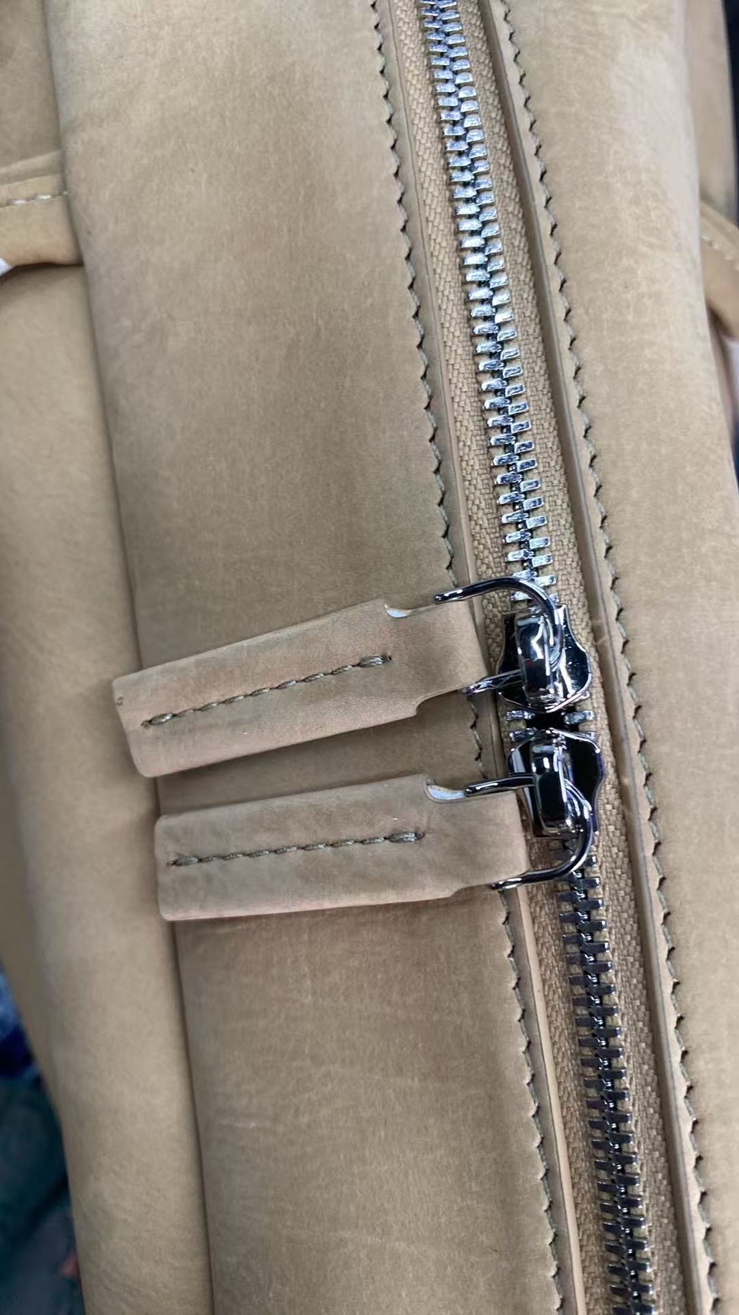 Silver-tone top zipper detail on camel baby calfskin Boston bag