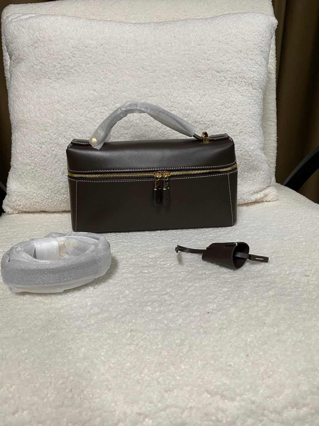 Calfskin box handbag with removable crossbody strap and lock charm