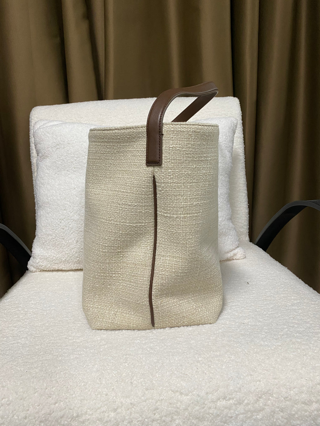 Linen bucket bag side view with brown leather trim