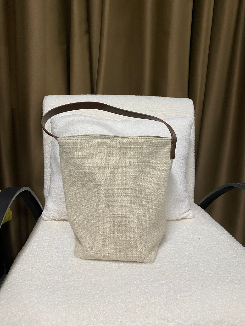 Natural linen bucket bag back view with leather strap