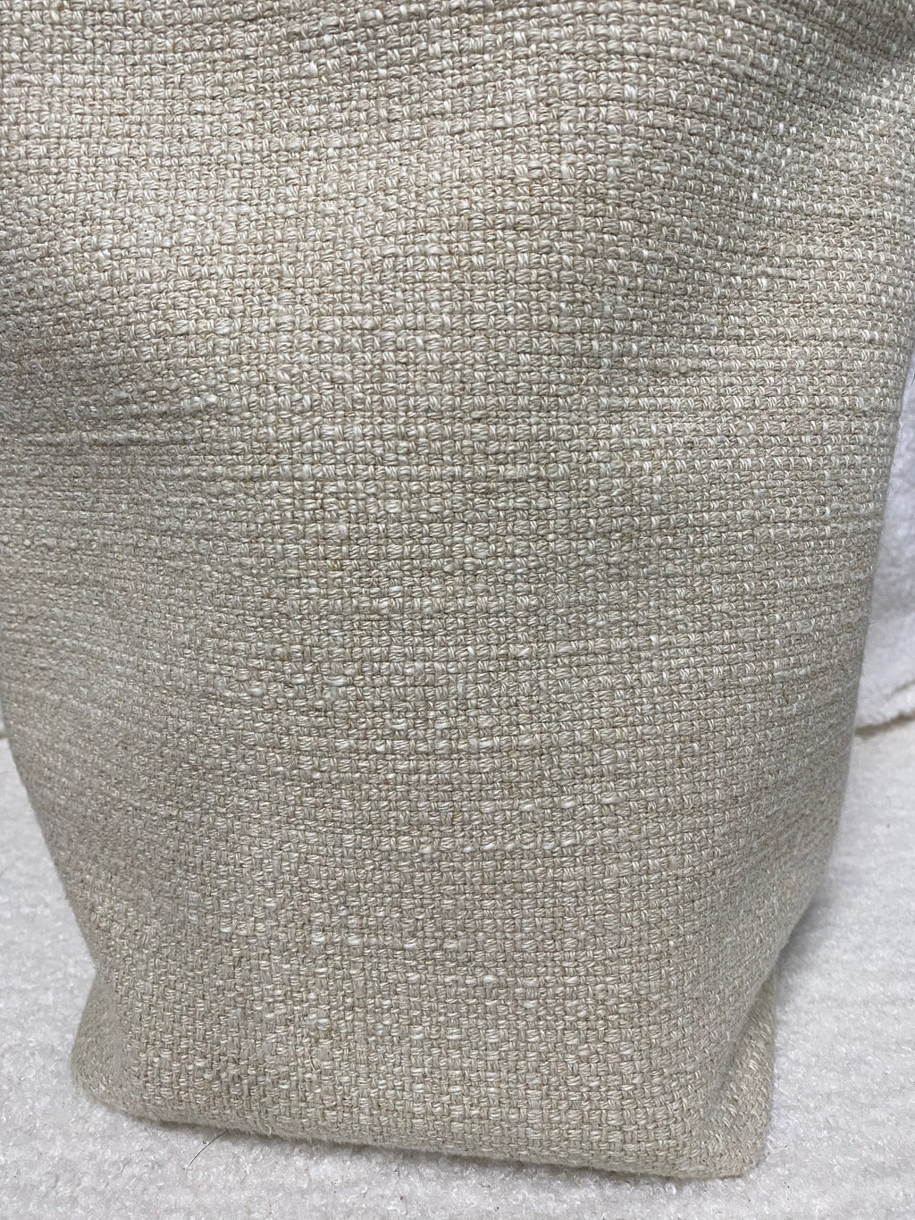 Natural woven linen texture close-up on bucket bag