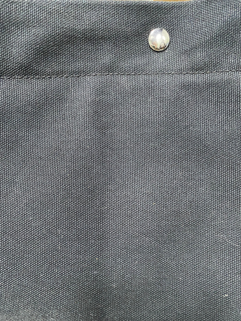 Silver snap closure on heavyweight navy canvas