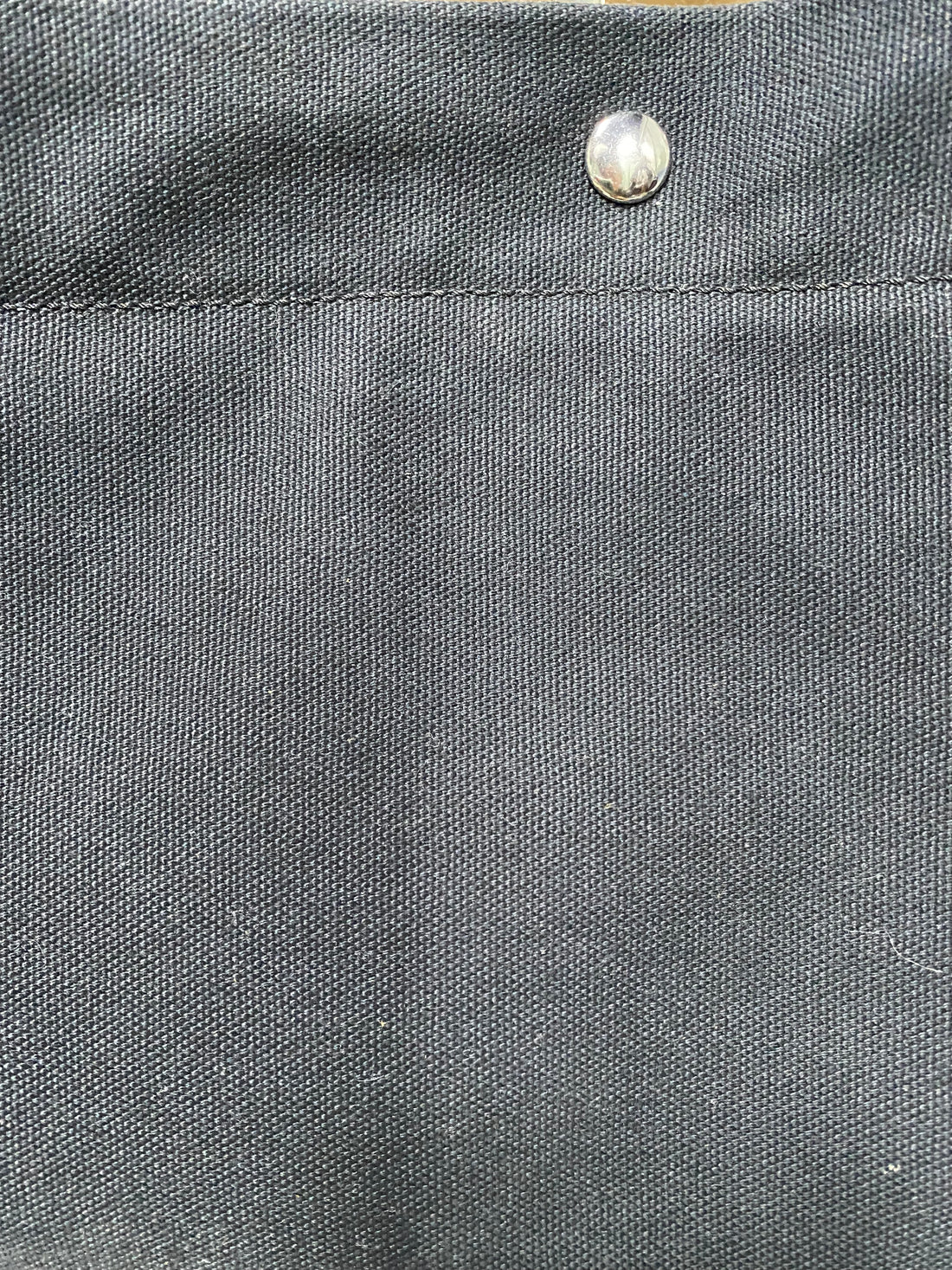 Silver snap closure on heavyweight navy canvas