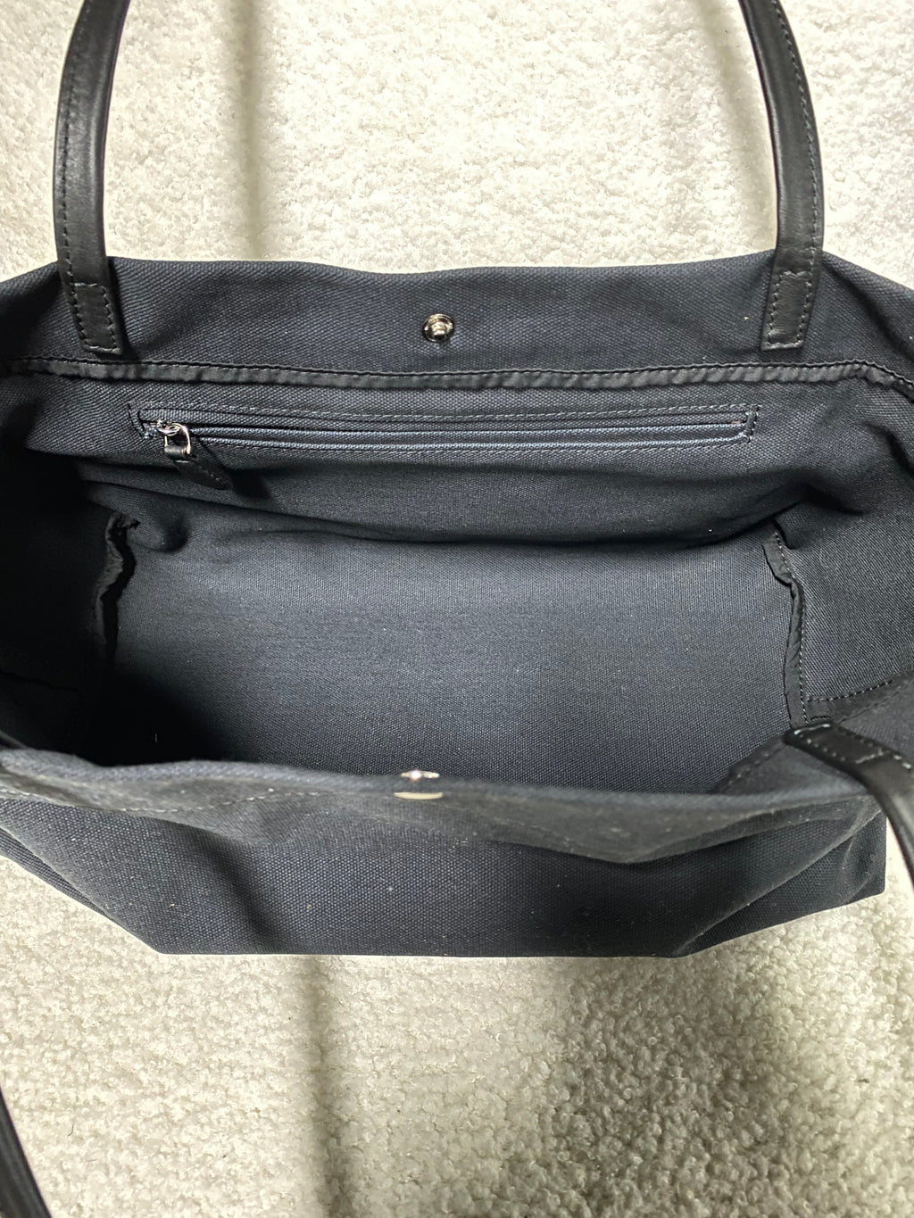 Open interior of large navy canvas shoulder tote