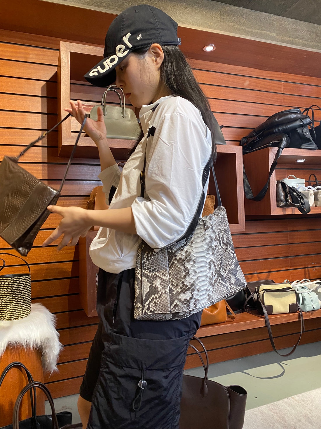 Brown genuine python leather shoulder bag — natural python version worn crossbody