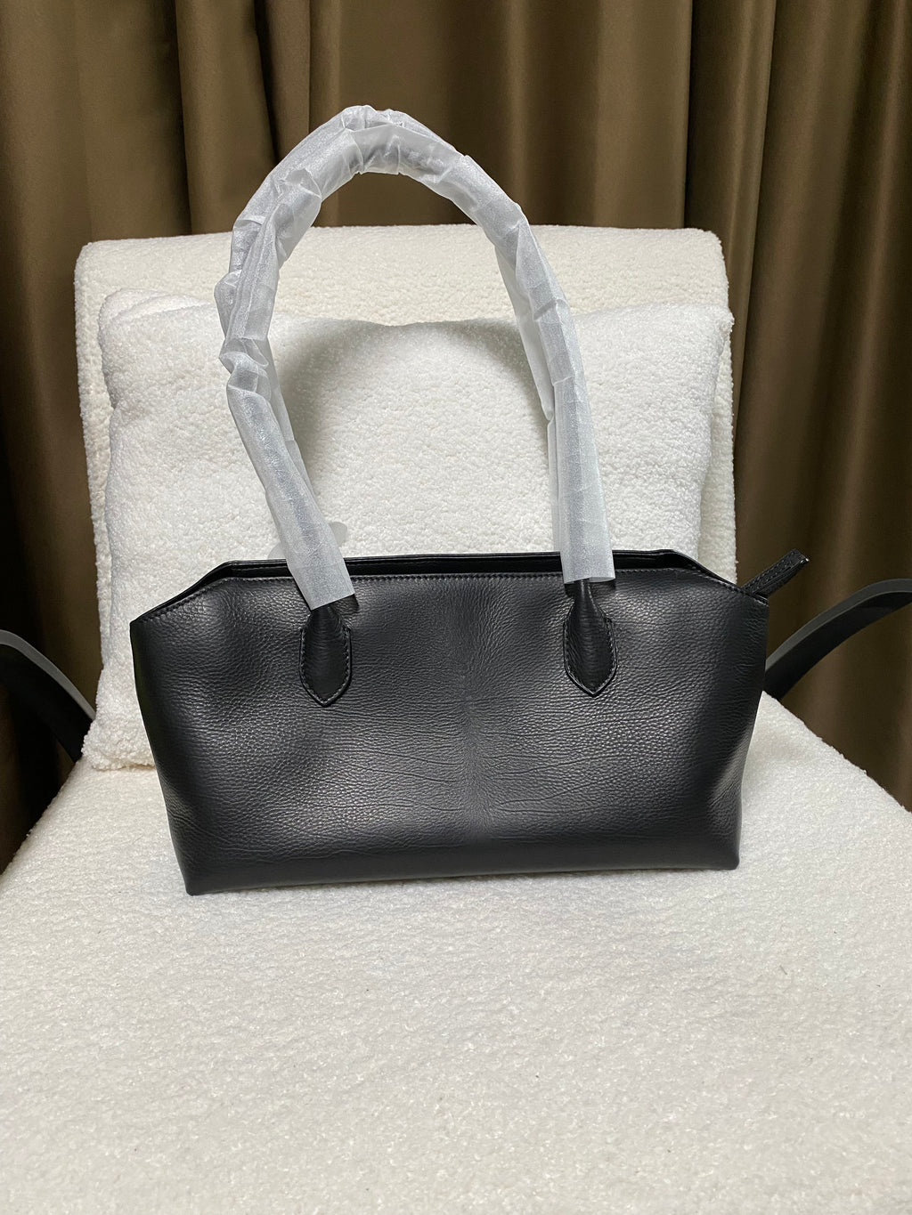 Black baby calfskin zip-top tote bag front view