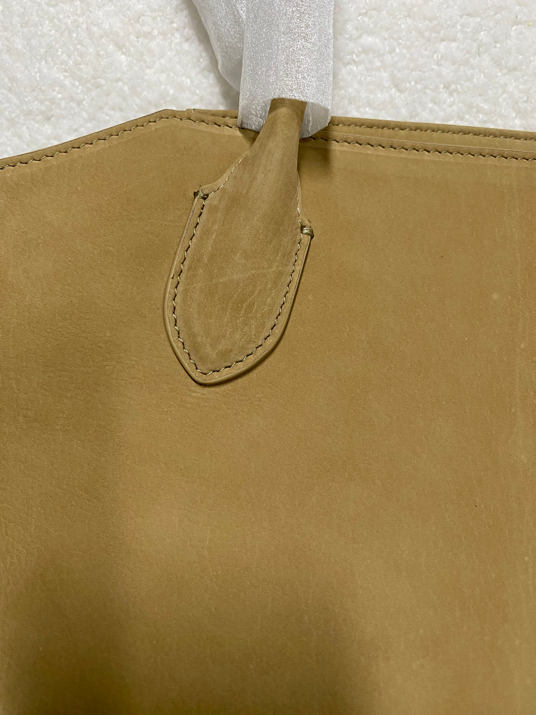 Stitched handle attachment on camel baby calfskin tote