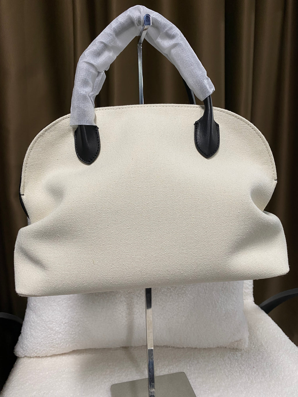 Cream linen dome handbag front view with black leather trim