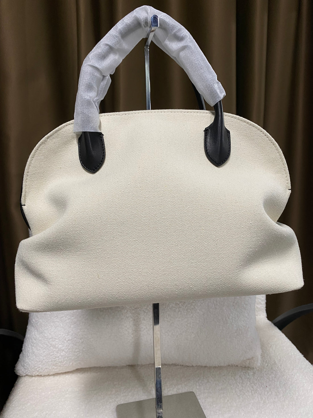 Cream linen dome handbag front view with black leather trim