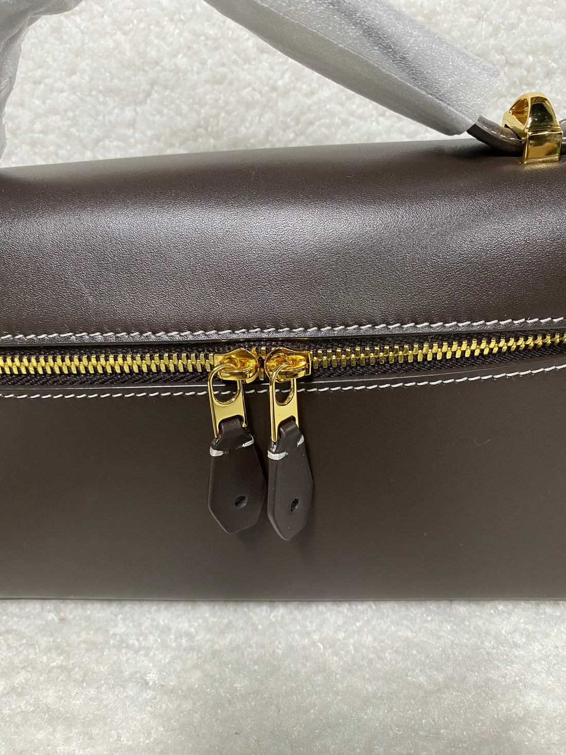 Gold zipper and leather pulls on smooth calfskin crossbody box bag