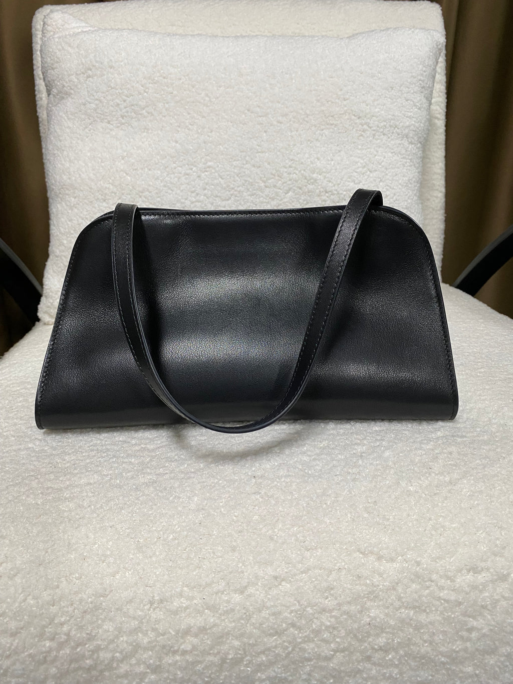 Smooth black leather shoulder bag rear three-quarter view