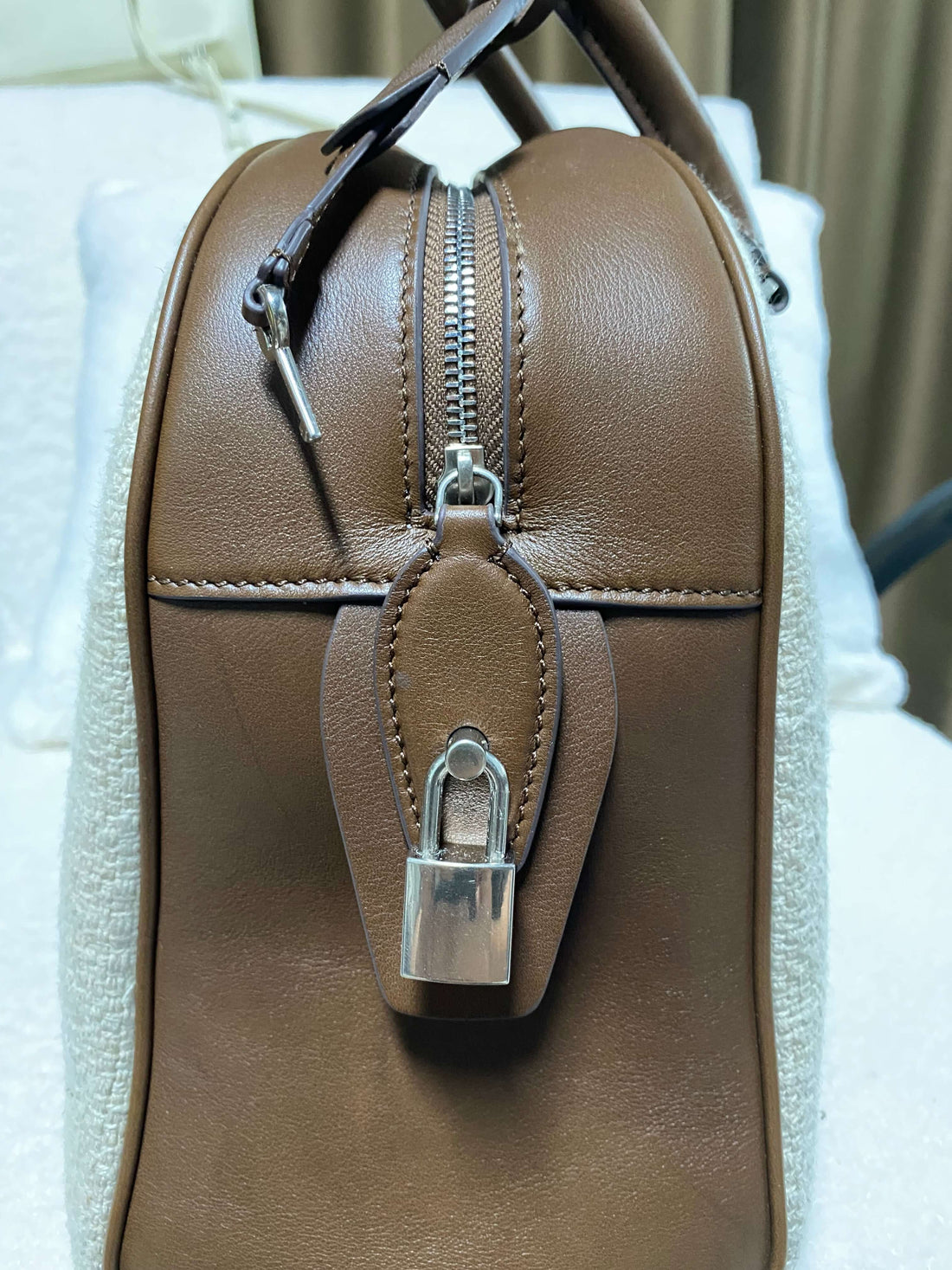 Logo-free linen and calf leather top-handle bag — brown leather side and zipper close-up