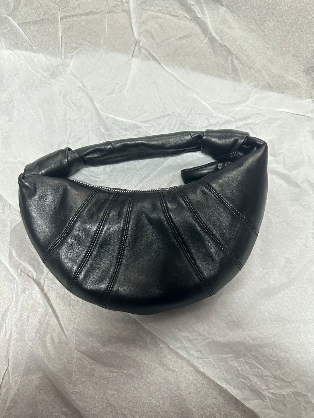 Minimalist leather croissant bag quiet luxury