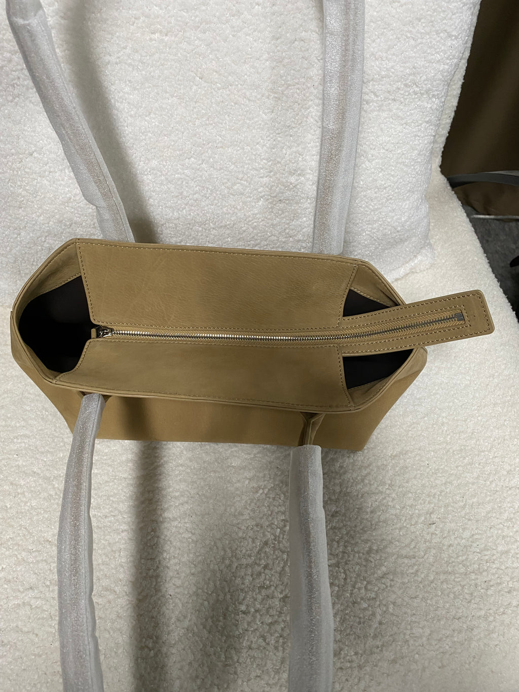 Top opening and double shoulder straps on camel calfskin tote