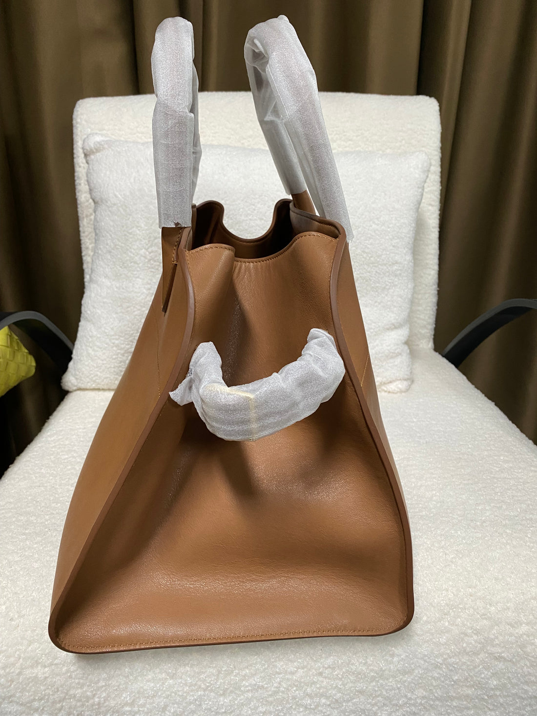 Brown leather work tote side profile with double handles