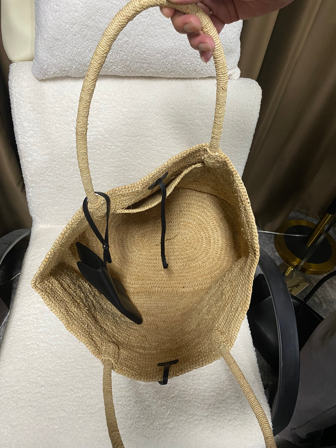 Open beige natural raffia tote with black detachable leather pouch