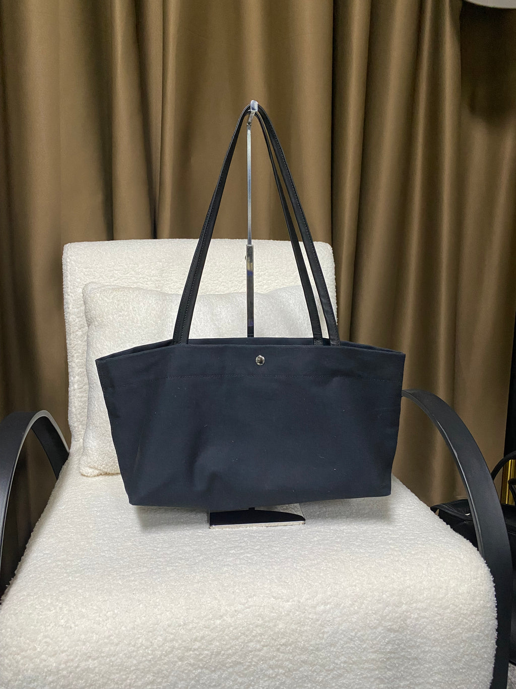 Navy horizontal canvas tote front view with snap closure