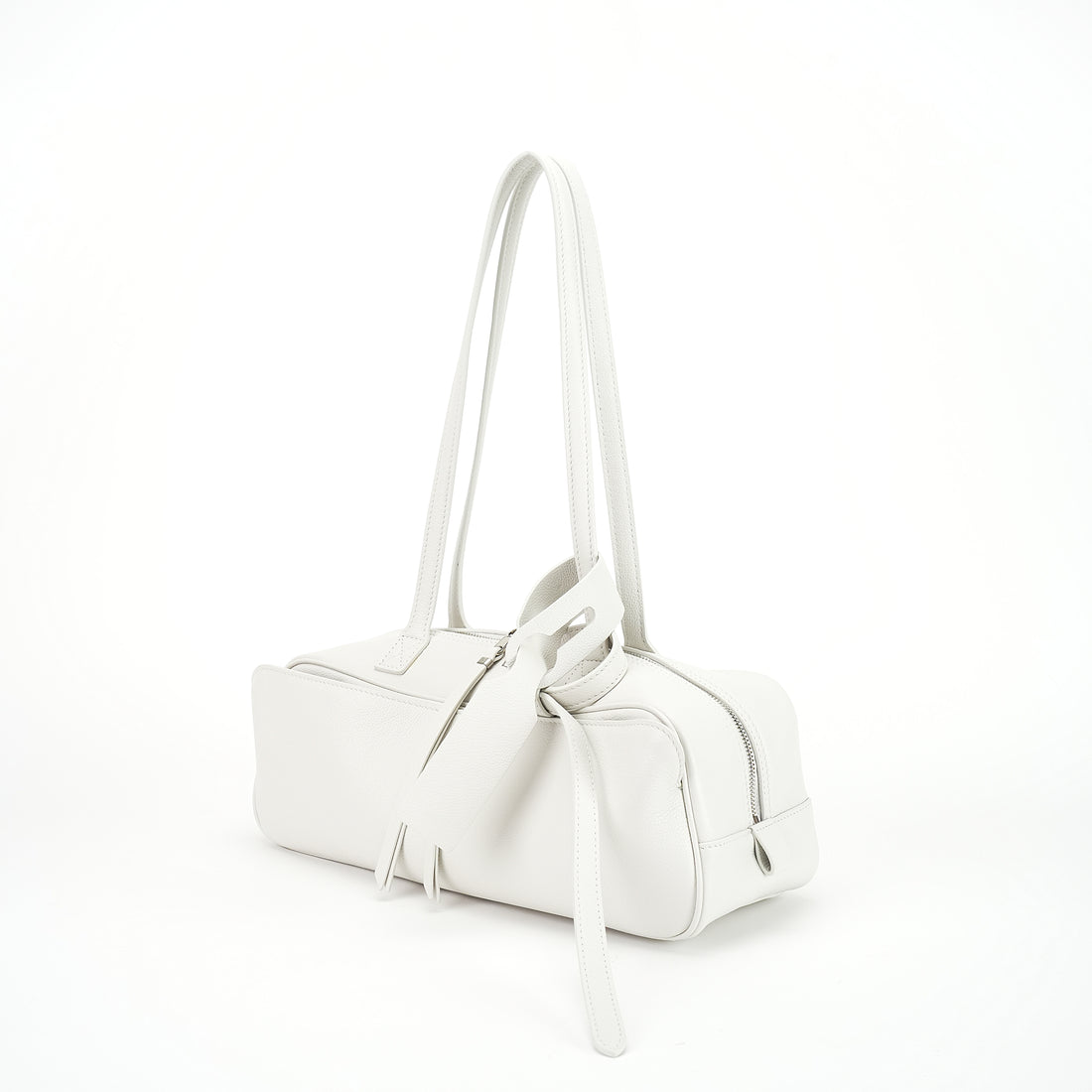 Logo-free cowhide bowling shoulder bag — white three-quarter front view