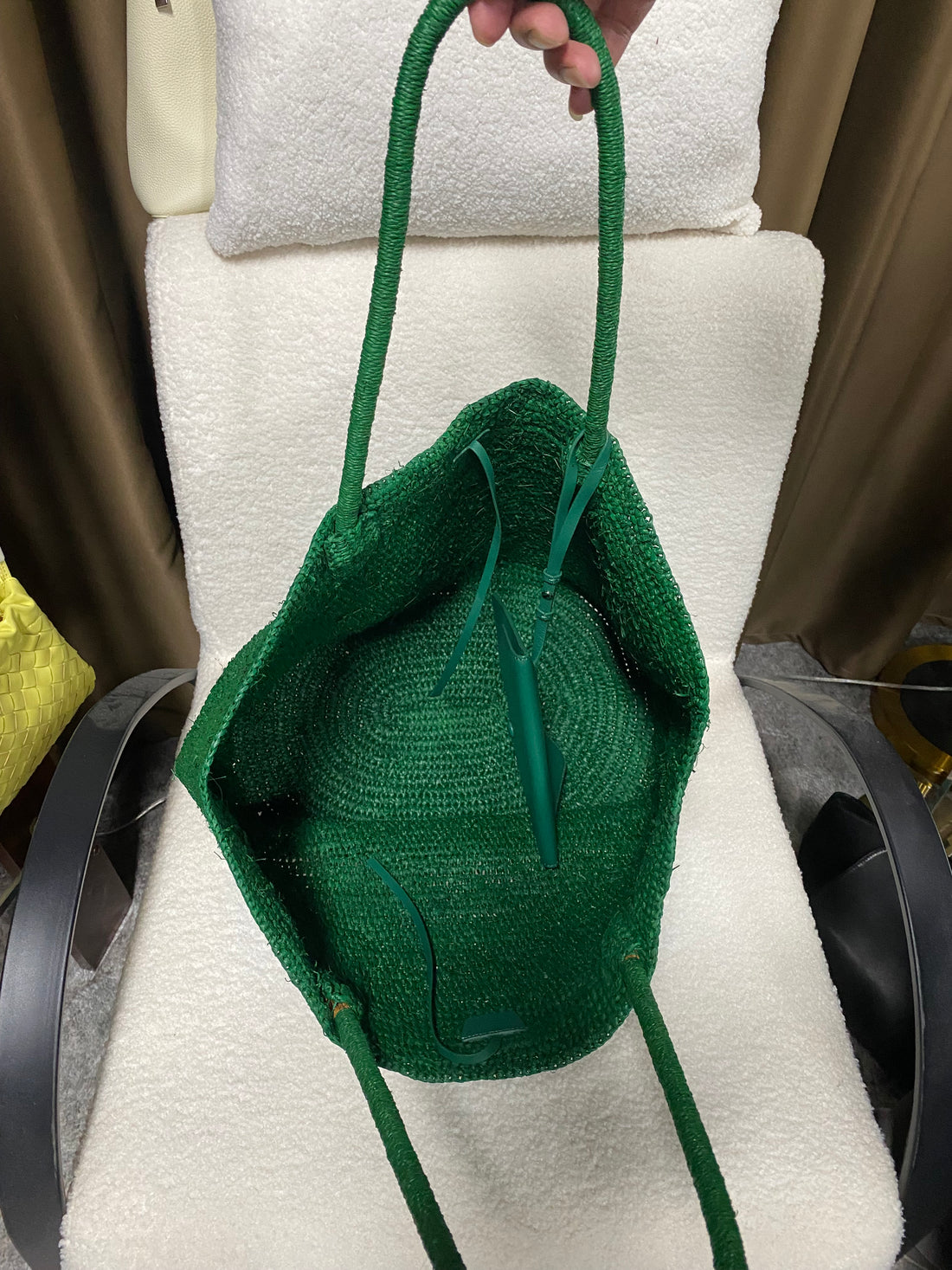 Open interior view of the emerald green natural raffia tote