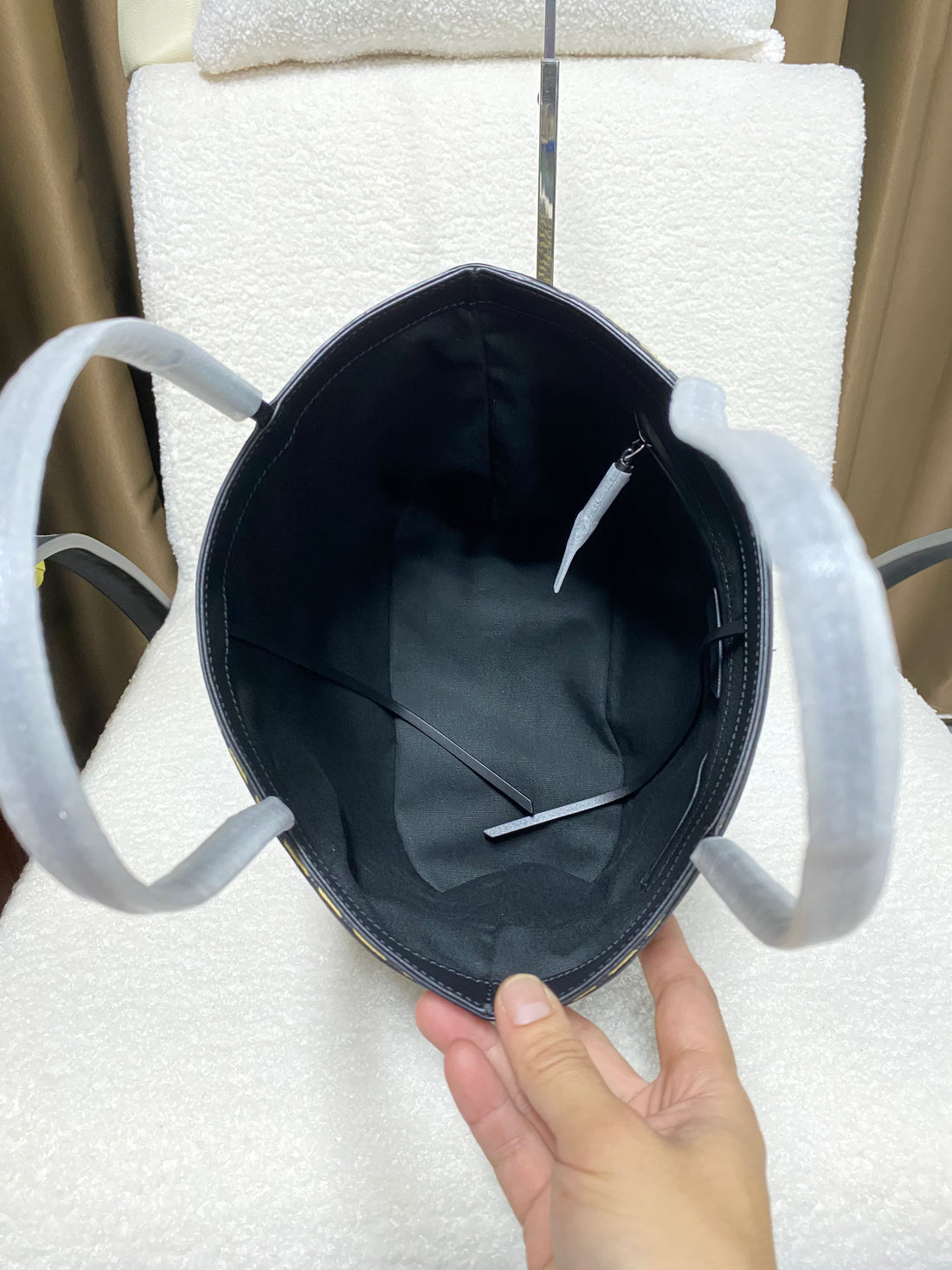 Logo-free handwoven striped bucket tote — open interior view
