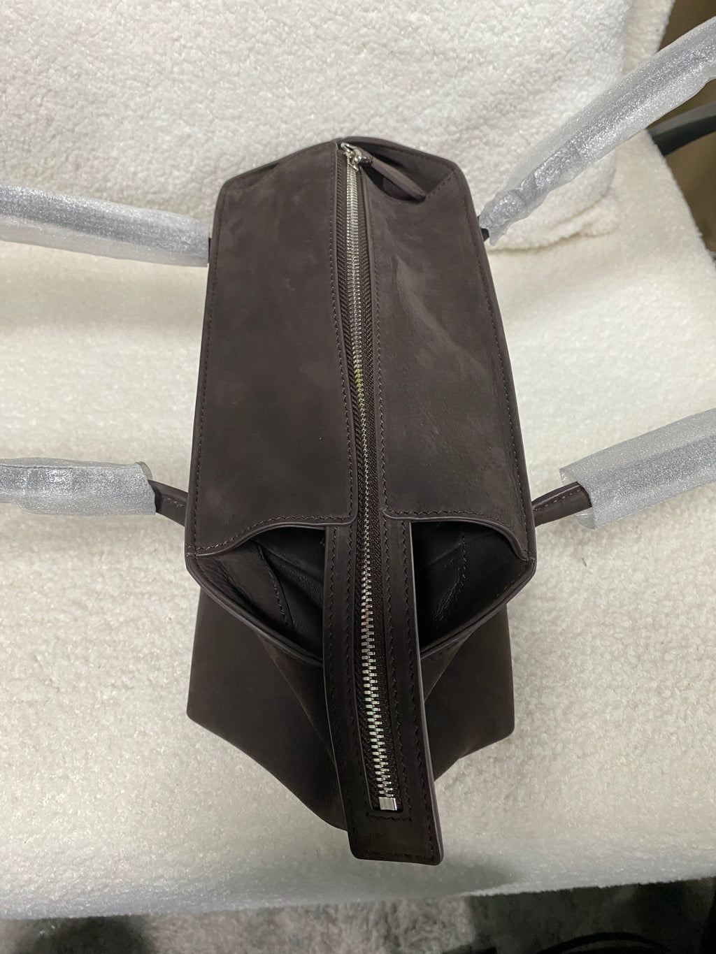 Dark brown calfskin tote side profile with top zipper