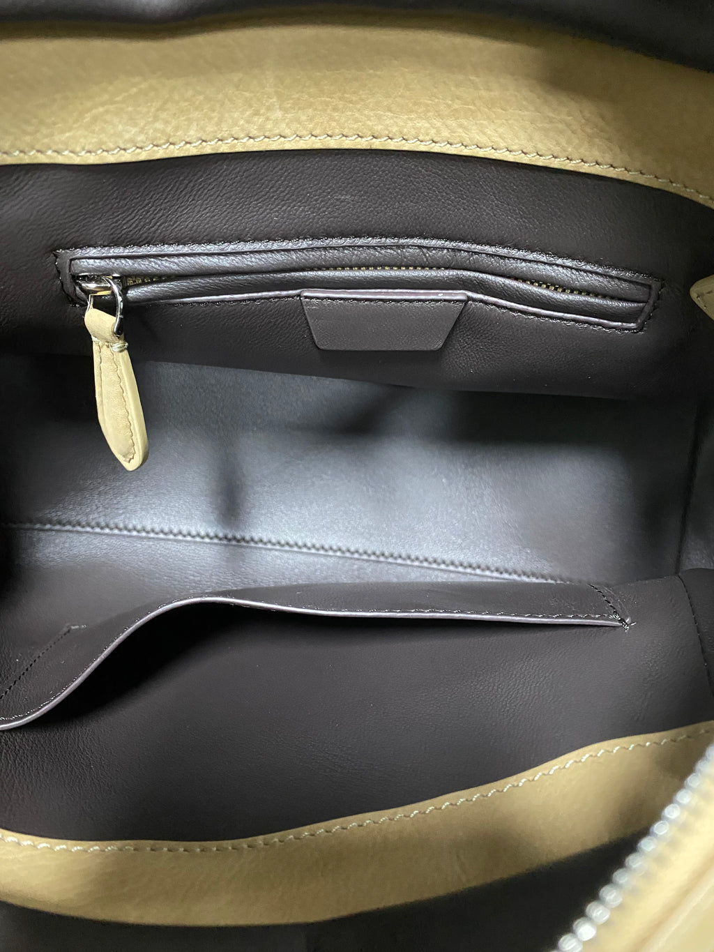 Grey leather-lined interior with zipper pocket inside calfskin tote