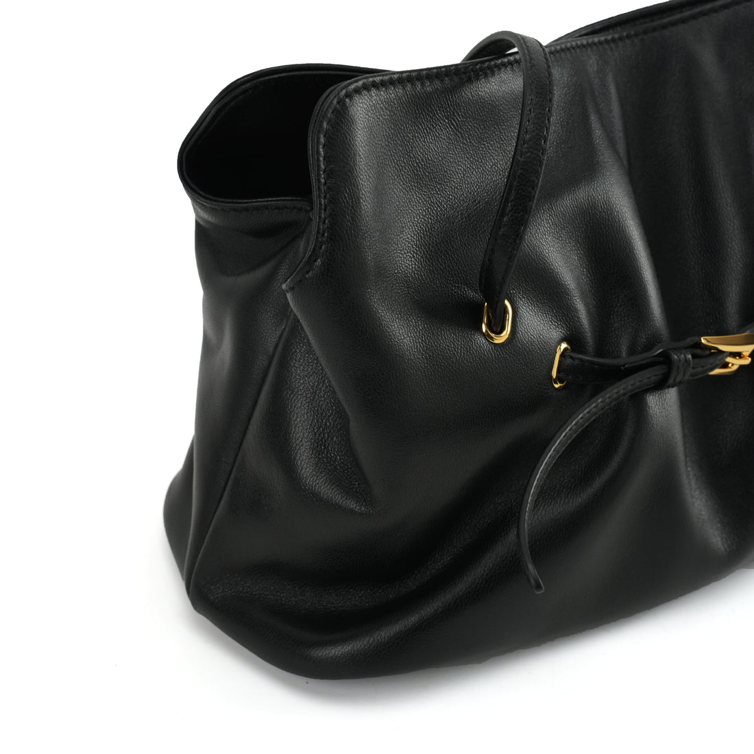 Black ruched lambskin crossbody bag — ruched side construction close-up