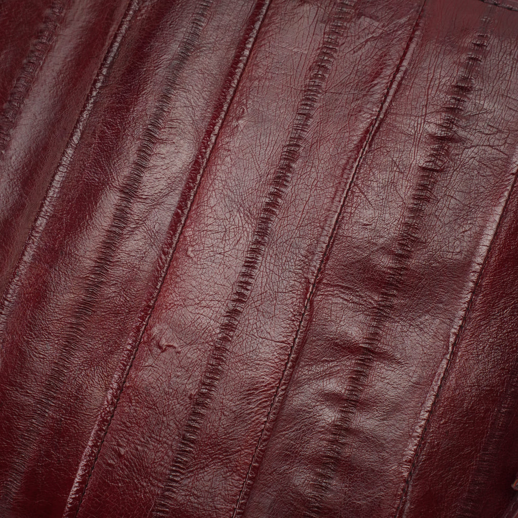 Burgundy genuine eel leather envelope clutch — eel leather striped texture close-up