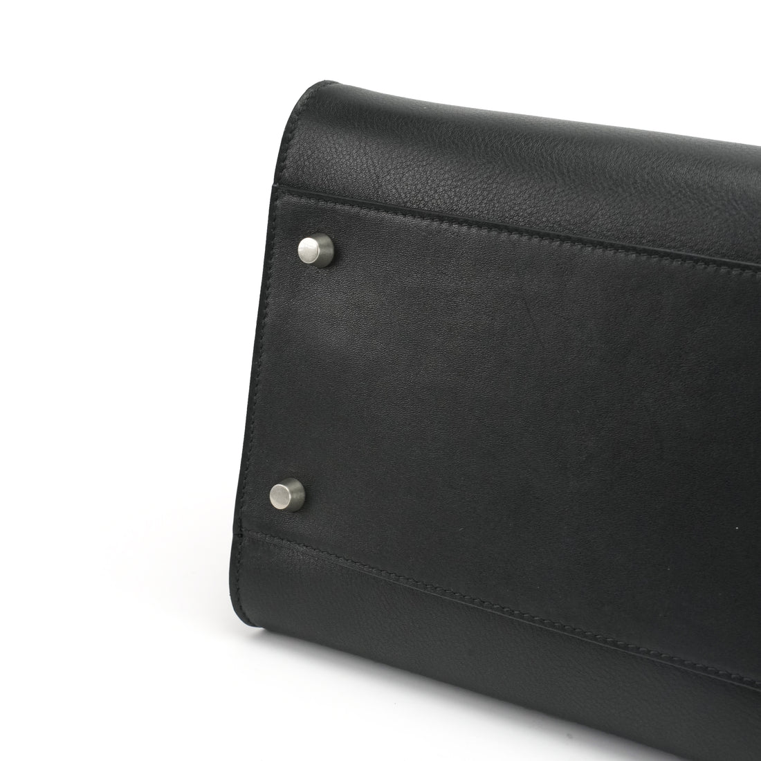Logo-free black cowhide work tote — leather base with protective feet