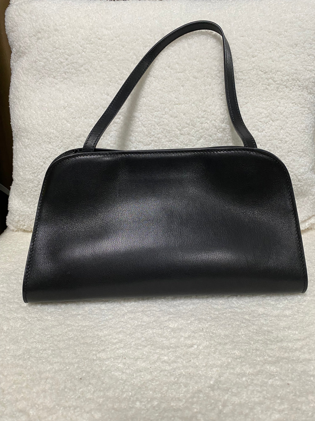 Smooth black leather shoulder bag front view with double straps