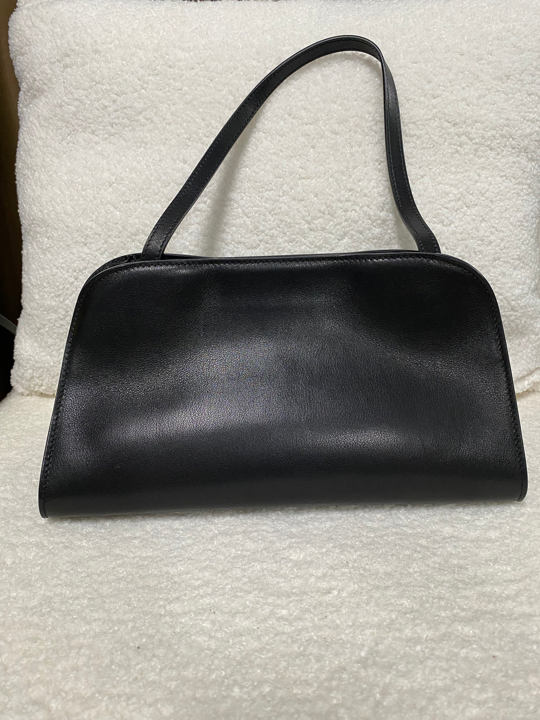 Smooth black leather shoulder bag front view with double straps