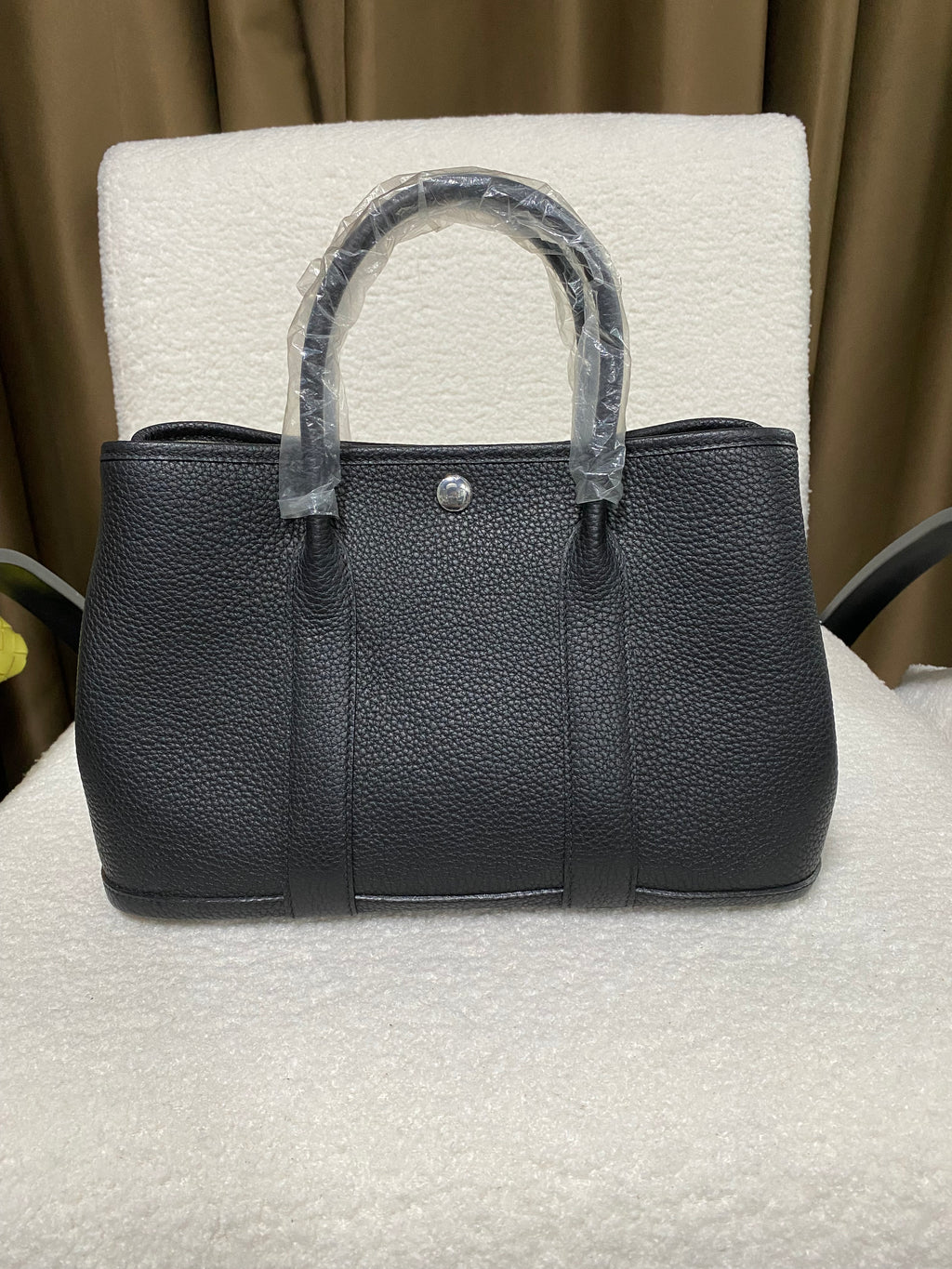Black wide-top leather snap tote front view