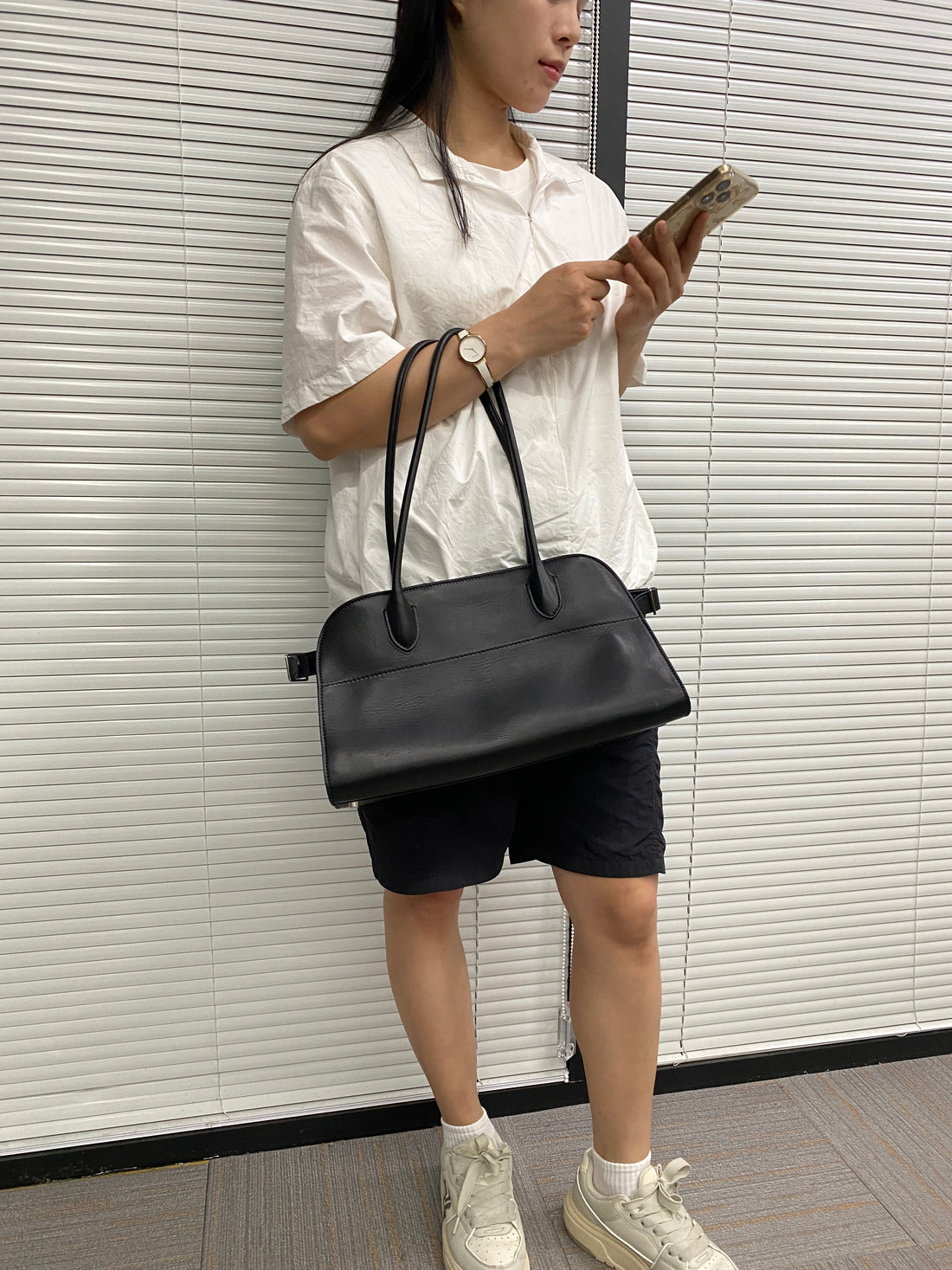 Minimalist black quiet luxury shoulder bag detail