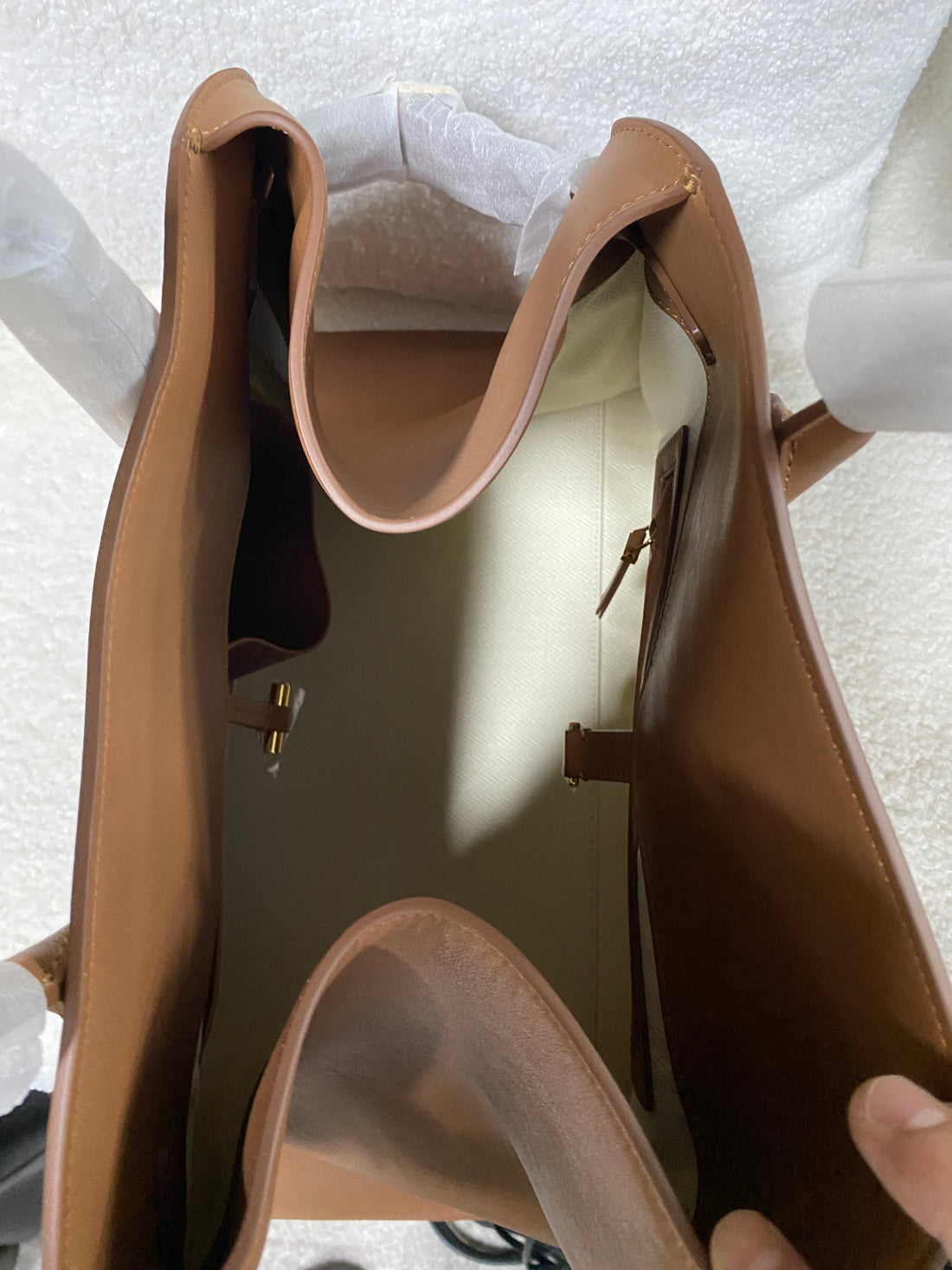 Open spacious interior of brown leather commuter tote