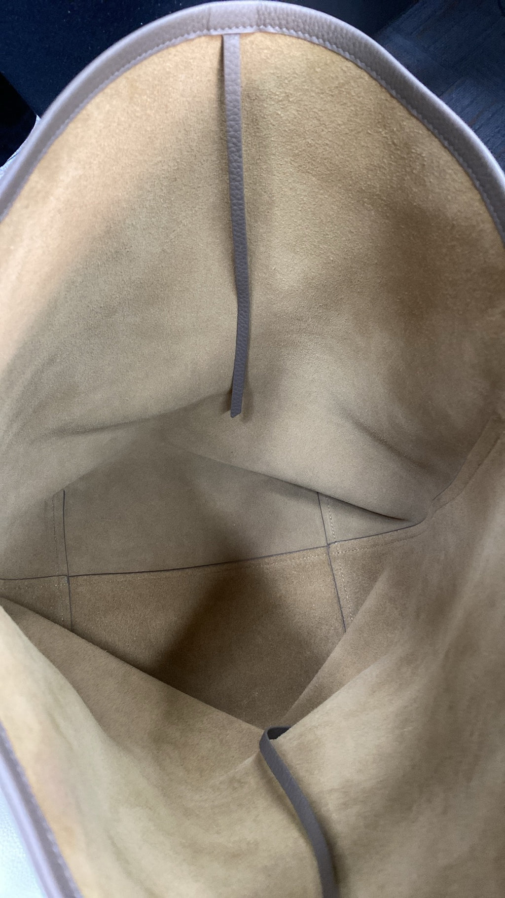 Suede-backed cowhide interior of full-grain leather bucket bag