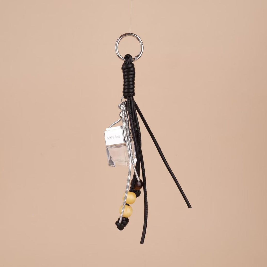 Black tassel bag charm with square glass perfume bottle and wooden beads