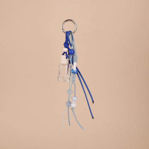 Blue beaded rope bag charm with mini clear glass bottle and silver ring